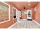 Bright sun room featuring tile floor, ceiling fans and multiple windows at 261 Melrose Sw Dr, Concord, NC 28025