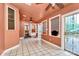 Bright sun room featuring tile floor, ceiling fans and multiple windows at 261 Melrose Sw Dr, Concord, NC 28025