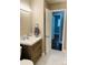 Updated bathroom features modern vanity, stylish fixtures, and marble tile flooring at 2823 Albany Ln, Charlotte, NC 28205