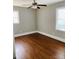 Bright bedroom featuring hardwood floors, neutral paint, and natural light at 2823 Albany Ln, Charlotte, NC 28205