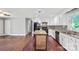 Spacious kitchen with an island, granite countertops, updated appliances, and hardwood floors at 2823 Albany Ln, Charlotte, NC 28205
