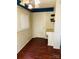 Cozy office space with hardwood floors, bright light, and built-in desk and shelving at 2823 Albany Ln, Charlotte, NC 28205