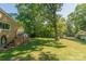 Backyard featuring a covered porch and lush lawn provides ample space for outdoor activities at 28782 Canton Rd # A, Albemarle, NC 28001