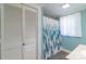 Bathroom with a curtained tub/shower combo and storage at 28782 Canton Rd # A, Albemarle, NC 28001