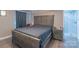 Comfortable bedroom with wood furnishings and an adjacent bathroom at 28782 Canton Rd # A, Albemarle, NC 28001