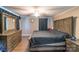Cozy bedroom with rustic wood furniture and ceiling fan at 28782 Canton Rd # A, Albemarle, NC 28001