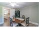 Dining room with a round wooden table and access to the kitchen at 28782 Canton Rd # A, Albemarle, NC 28001