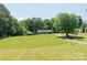 Beautiful view of the property with a large lawn and tree-lined driveway at 28782 Canton Rd # A, Albemarle, NC 28001