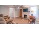 Inviting living room features a brick fireplace, ceiling fan, and plenty of natural light at 28782 Canton Rd # A, Albemarle, NC 28001