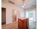 Bright kitchen with an island, wood floors, and access to a patio at 3055 Golden Dale Ln # 104, Charlotte, NC 28262