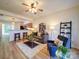 Inviting living room with wood floors, seating, and an open layout flowing into the kitchen at 3055 Golden Dale Ln # 104, Charlotte, NC 28262