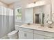 Functional bathroom featuring neutral walls, tile flooring and double vanity, offering convenience at 3135 Everly Enclave Way, Charlotte, NC 28210