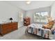 Cozy bedroom with natural light, complemented by carpeted floors and neutral walls at 3135 Everly Enclave Way, Charlotte, NC 28210