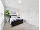 Bright bedroom featuring soft, neutral walls and carpeted floors, creating a cozy space at 3135 Everly Enclave Way, Charlotte, NC 28210