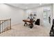 Versatile bonus room with carpeted floors, ideal for a home office or entertainment space at 3135 Everly Enclave Way, Charlotte, NC 28210