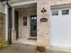 Close-up of front door with brick facade and wreath, showing house number 3135 at 3135 Everly Enclave Way, Charlotte, NC 28210