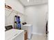 Efficient laundry room with appliances and shelving for storage at 3135 Everly Enclave Way, Charlotte, NC 28210