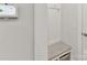 Mudroom area with built-in bench and storage hooks, creating an organized entryway at 3135 Everly Enclave Way, Charlotte, NC 28210