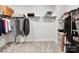 Organized walk-in closet with shelving and hanging rods at 3135 Everly Enclave Way, Charlotte, NC 28210