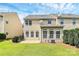 A well maintained backyard, including a grassy area and a small patio at 3251 Park South Station Blvd, Charlotte, NC 28210