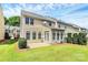 Spacious backyard featuring a well-maintained lawn, patio area, and privacy landscaping at 3251 Park South Station Blvd, Charlotte, NC 28210