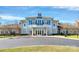 Elegant community clubhouse featuring a covered entrance, lots of windows, and manicured landscaping at 3251 Park South Station Blvd, Charlotte, NC 28210