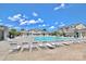 Large community pool area with abundant lounge chairs, clubhouse, and meticulous landscaping at 3251 Park South Station Blvd, Charlotte, NC 28210