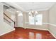 Elegant dining room showcasing hardwood floors and a graceful chandelier fixture at 3251 Park South Station Blvd, Charlotte, NC 28210