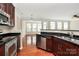 Stylish kitchen with stainless steel appliances and seamless flow to living spaces at 3251 Park South Station Blvd, Charlotte, NC 28210