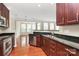 Well-equipped kitchen showcasing stainless steel appliances and dark wood cabinets at 3251 Park South Station Blvd, Charlotte, NC 28210