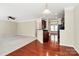 Spacious, open-concept living area showcases hardwood floors, and connects to the kitchen at 3251 Park South Station Blvd, Charlotte, NC 28210