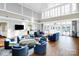 Large community lounge with an open floor plan, luxury furnishings, and big windows at 3251 Park South Station Blvd, Charlotte, NC 28210