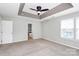 Spacious main bedroom with neutral walls, carpet floors, and a ceiling fan at 3251 Park South Station Blvd, Charlotte, NC 28210