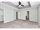Spacious main bedroom with neutral walls, carpet floors, and a ceiling fan at 3251 Park South Station Blvd, Charlotte, NC 28210