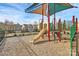 Community playground featuring slides, climbing structures, and shade sails providing a fun and safe play area at 3251 Park South Station Blvd, Charlotte, NC 28210