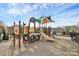 Community playground with a variety of play structures and a cushioned ground surface, perfect for families to enjoy at 3251 Park South Station Blvd, Charlotte, NC 28210
