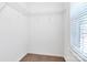 Walk-in closet featuring white walls, carpet flooring, and adjustable wire shelving at 3251 Park South Station Blvd, Charlotte, NC 28210