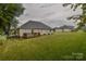 Spacious backyard featuring a deck, grassy area, and a well-maintained lawn at 330 Kilmer Ln, Mooresville, NC 28115