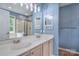 Well-lit bathroom with a double vanity, shower, and mirror at 330 Kilmer Ln, Mooresville, NC 28115