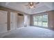 Spacious bedroom with ceiling fan and lots of natural light from the window at 330 Kilmer Ln, Mooresville, NC 28115