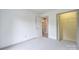 Neutral bedroom with large closet space, connecting to the bathroom with neutral carpet at 330 Kilmer Ln, Mooresville, NC 28115