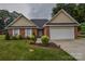 Charming single-story brick home with well-manicured lawn and attached two-car garage at 330 Kilmer Ln, Mooresville, NC 28115