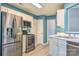 Modern kitchen with stainless steel appliances, white cabinets, and plenty of counter space at 330 Kilmer Ln, Mooresville, NC 28115