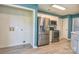 Kitchen featuring stainless steel refrigerator and microwave oven, with wood-look floors at 330 Kilmer Ln, Mooresville, NC 28115