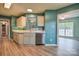 Kitchen with stainless steel dishwasher and a view to a bright dining area at 330 Kilmer Ln, Mooresville, NC 28115