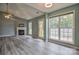 Bright living room with a fireplace, ceiling fan, and plenty of natural light at 330 Kilmer Ln, Mooresville, NC 28115