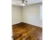 Cozy bedroom with hardwood floors, natural light, and ample space at 3701 Tipperary Pl, Charlotte, NC 28215