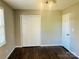 Comfortable bedroom with hardwood flooring, neutral walls, and a closet for storage at 3701 Tipperary Pl, Charlotte, NC 28215