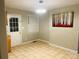 Bright dining area with tile floors, a large window, and a painting adding a touch of color at 3701 Tipperary Pl, Charlotte, NC 28215