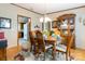 Elegant dining room featuring a wooden table and chairs, a decorative hutch, and a seamless flow to the kitchen at 404 St Lukes Church Rd, Kings Mountain, NC 28086